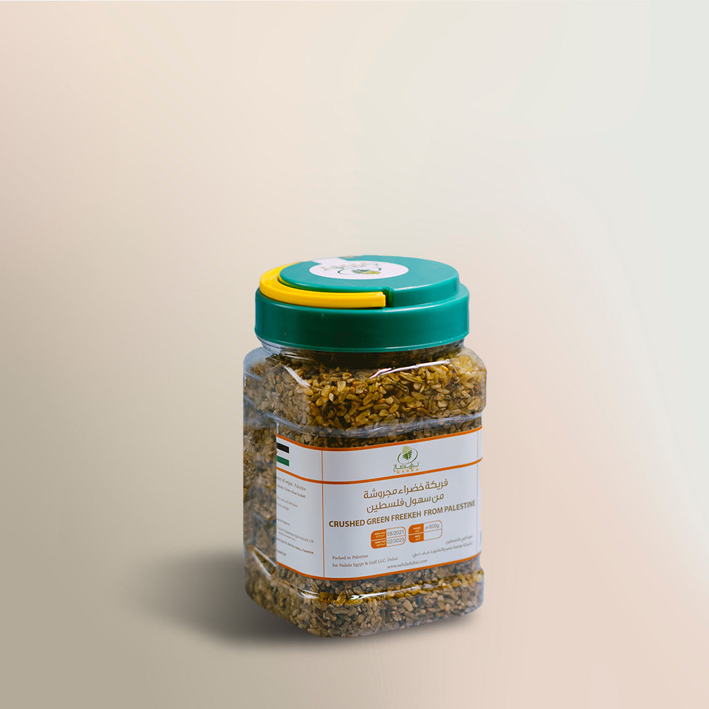 crushed green freekeh in a plastic bottle
